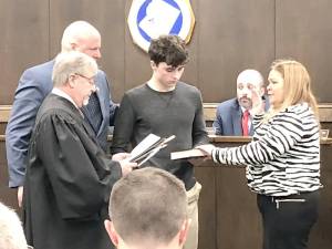 Michelle Teets is sworn in after she is elected mayor of Newton during the annual reorganization meeting Jan. 5. Standing with her are her husband, Ken, and nephew Robert McCullough.(Photos by Kathy Shwiff)