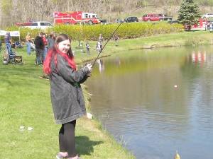 Success! Olivia from Vernon reels in a catch. (Photo by Janet Redyke)