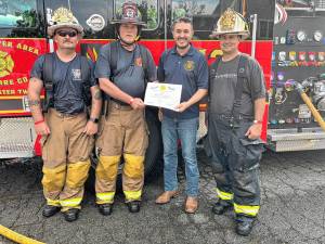 From left are Fire Chief Dwane Banghart, chief engineer Richard Wright, state Assemblyman Mike Inganamort and Deputy Fire Chief Steven Sugar at the Stillwater Area Volunteer Fire Company’s dual wetdown on Saturday, August 16. The event celebrated new equipment, including a 2024 Seagrave Marauder and a 2024 Ram 3500. (Photo courtesy of Mike Inganamort)