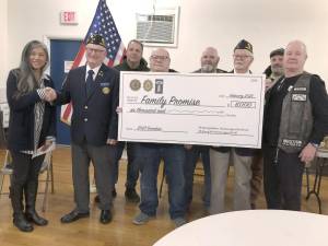 From left are Hazel Yaptangco of Family Promise; American Legion Post 86 Commander Bob Glesias; Mike Matera; Sons of American Legion Post Commander Frank Gerardi; Joe Luchetti; Harry Kaplan, a former American Legion commander; Ray Licameli; and Jimmy Gaffney. Matera, Luchetti, Licameli and Gaffney are part of the Band of Brothers. (Photo by Kathy Shwiff)