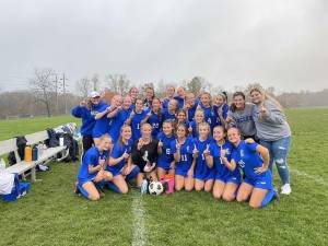 The Kittatinny Cougars pose after winning the Freedom League championship.