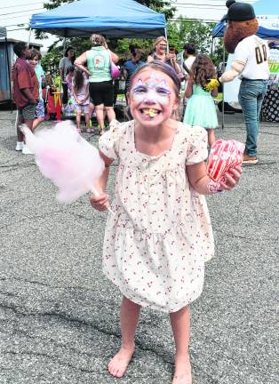 Aubrey Wilson of Hampton holds popcorn and cotton candy.