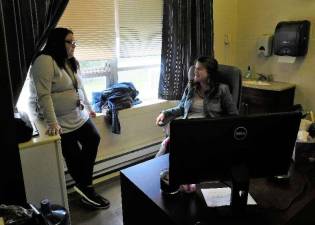 2015 Lakeland Andover School graduate Desiree Torres catches up with Child Study Team leader Sandi Bloom in her office on Wednesday, Oct. 17.