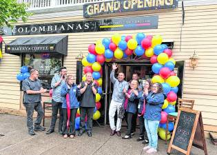 Hector Echeverri, owner of the Raíces Colombianas, celebrates the restaurant’s grand opening.