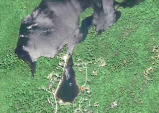 The dam is located between the private Glen Lake and Newton Reservoir