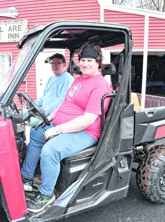 <b>Bob Martinelli of Morris Plains and Adam Elmers from Oak Ridge are shonw in a cart.</b>