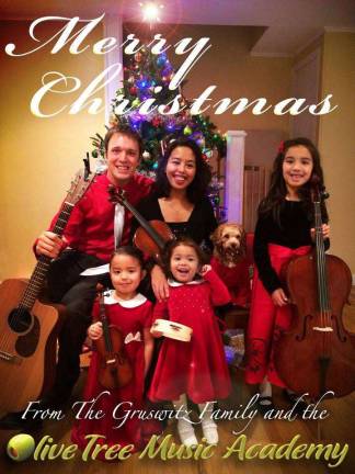 Andy and Trish Gruswitz of Andover, N.J. Local business owners with their three daughters and puppy. 11 years together this year.