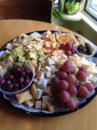 'Between the Bread' specialties: gourmet breakfast, lunch, cheese and catering