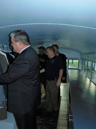 (Front to rear) State Senator Steve Oroho (R-24), Sussex County Sheriff Mike Strada, Assemblyman Hal Wirths (R-24) and Assemblyman Parker Space (R-24) check out the clothing racks on the newly unveiled Project Help mobile closet for veterans, after a ceremony held Tuesday, Sep 10, 2019 at Sussex County Community College in Newton.