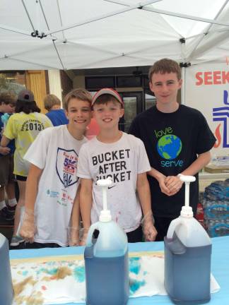 Photos by Laurie Gordon Caedon Jones (center) of Stillwater, sells cotton candy and slushies with his church friends, Connor McQuillen (left) and Ryan McQuillen (right).