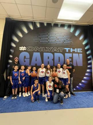 Benjamin Davey, back left, with young players he coaches: Leland McCarthy, Kieran McCarthy, Everett Little, Carter Davey, Audrina Trogani, Addison Garrigan, Lily Davey, Caitlyn Rutienberg, Olivia Herzenberg, Joey Trogani and Harper Little. Standing at back right is assistant coach Brad Little and kneeling at right is Heather Davey.