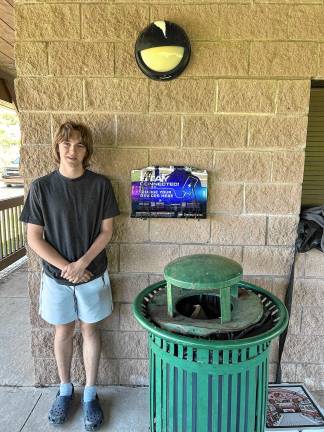 Gavin Lake of Kittatinny Troop 92 stands next to the new phone-charging station at Lodestar Park Pavilion in Fredon. (Photos provided)