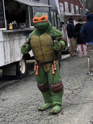 A visitor to the Winter Fest ’24 is dressed as one of the Teenage Mutant Ninja Turtles. (Photo by Kathy Shwiff)