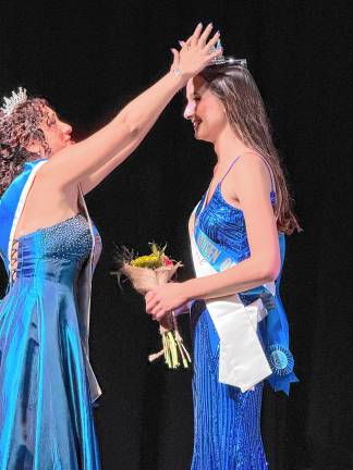 <b>2024 Queen of the Fair </b>Chaya Ortega, left, places the tiara on the head of <b>2025 Queen of the Fair </b>Sophie Schaeffner. Both are from Lafayette.