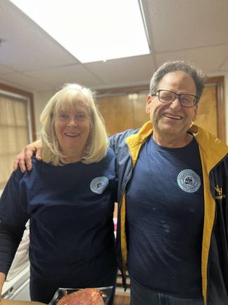 Pat Convey and Richard Parimuha are all smiles on a volunteer Friday in Sparta. Photo courtesy of Valerie Macchio.