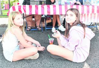 Dianna and Annalise Zito of Newton paint rocks.