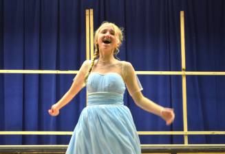 Seventh grade student Anya Pucci, playing the role of Princess Elsa, sings a song during rehearsal of Pope John XXIII Middle school’s presentation of Disney’s “Frozen JR.” on Monday at Reverend George A. Brown’s McKenna Hall.