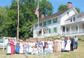 The Chinkchewunska Chapter of the National Society Daughters of the American Revolution celebrate Christmas in July.