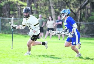 West Milford's Brendan Coscia carries the ball while being pursued by Kittatinny's Niko Martinez. Coscia scored 1 goal.