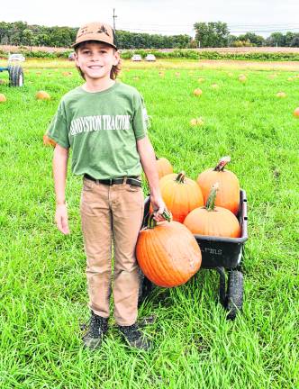 Landon Nichols of Frankford shows off his pumpkins.