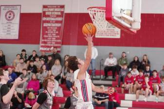 LV1 Lenape Valley’s Anthony Kali goes high toward the hoop during a shot attempt Saturday, Dec. 16. He scored 14 points in the game at High Point. The Wildcats won, 43-40. (Photos by George Leroy Hunter)