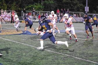 <b>Jefferson ball carrier Braedan Cummings on the run in the game against Whippany Park at home Friday, Sept. 26. Jefferson won, 48-26, and Cummings made one touchdown. (Photos by George Leroy Hunter)</b>