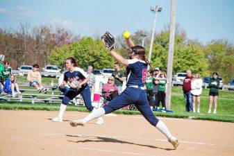 Lenape Valley pitcher Paige Henriksen winds up while third-base player Sydney Stansfield stands ready for action in the game against Newton on Friday, April 26. The Patriots won, 11-1. (Photos by George Leroy Hunter).