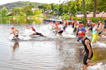 Pass it Along’s 14th annual Triathlon begins with the swim course Saturday, July 26 in Lake Mohawk in Sparta. More than 200 people of all ages and experience levels participated. (Photos by Maria Kovic)