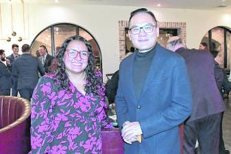 Angelica Chapman of First Hope Bank and Kevin Kuo of White Deer Innovation are shown.