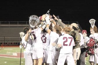 Newton High School boy’s lacrosse players celebrate a well fought season.