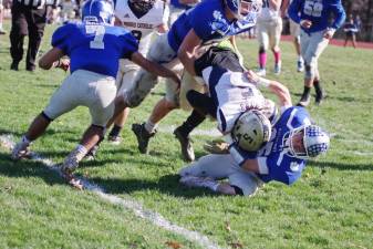 After a long gain Kittatinny ball carrier Jacob Mafaro is caught by Morris Catholic defenders in the second quarter. Mafaro rushed for 135 yards and scored 1 touchdown.
