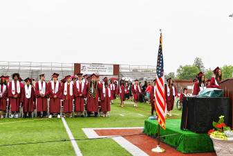 Members of the Newton High School Class of 2025 stand during graduation Monday, June 16. (Photo by Maria Kovic)