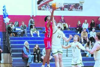 Lenape Valley's Gabriel Quarranttey takes the ball toward the hoop in the Feb. 16 game against Sussex Tech. The Patriots lost, 52-39. (Photo by George Leroy Hunter)