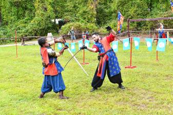 SRF1 Two knights demonstrate their sword-fighting skills Sunday, Sept. 7 at the Sparta Renaissance Festival. (Photo by Maria Kovic)
