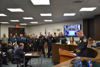 Joseph D’Annibale, right, at the podium, retired last week.