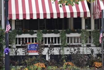 A Lisa Emery sign at Hotel Fauchère, one of Bill Rosado’s buildings, which was until recently owned by mayoral incumbent Sean Strub. (Photo by Becca Tucker)