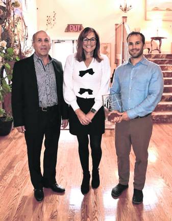 Anthony Berardi, County Commissioner Jill Space and Alex Berardi posing for me. Berardi Building Co., LLC, won the Redevelopment Award.