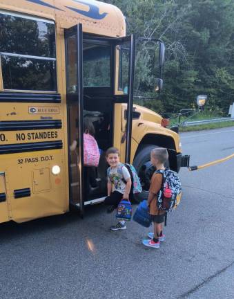 TK1 Billy boards the bus for kindergarten. Please see more photos online at www.townshipjournal.com (Photo provided)