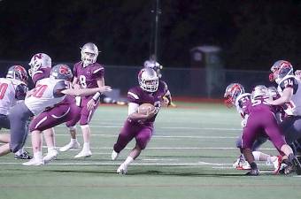 Newton ball carrier Takeo Sibblies runs through an opening in the High Point defense in the fourth quarter (Photo by George Leroy Hunter)