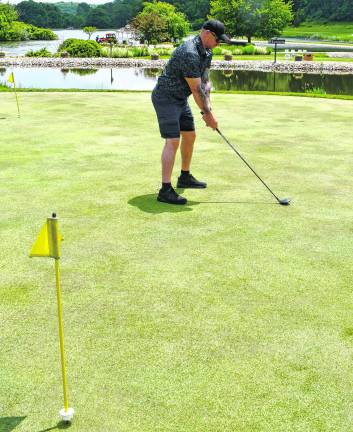 Chris Flibel of the Sparta Police Dept. lines up his shot.