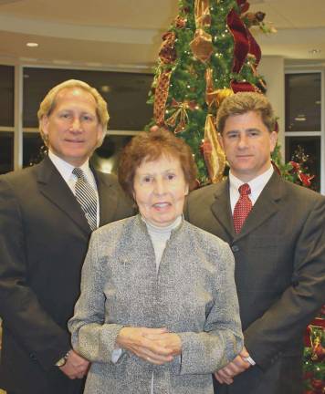 From left, Louis Ruggiero, president of Iliff-Ruggiero Funeral Home; Julia Quinlan, co-founder and president of Karen Ann Quinlan Hospice; and Domenick Ruggiero, manager of Iliff-Ruggiero Funeral Home gather at last year’s Lights of Life Tree Lighting Memorial Service at Sussex County Community College to embrace area families with this thoughtful holiday tradition.