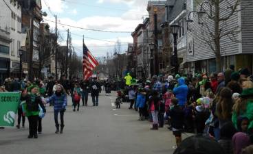 Crowds enjoy the 2019 St. Patrick's Day Parade in Newton. This year's parade, along with many other events, has been postponed indefinitely due to concerns over the spread of COVID-19.