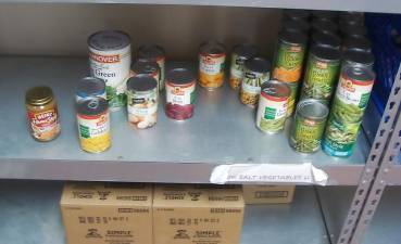 The almost bare shelves at the St. Francis de Sales Food Pantry await needed donations.