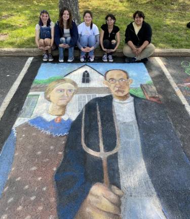 Students create chalk artworks