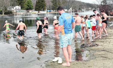 Swimmers go into the water during the Polar Plunge