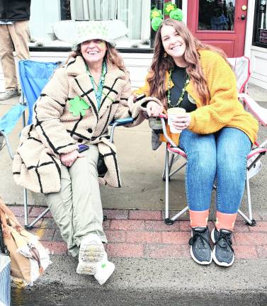 Erin DeLuca and Chloe Smith, both of Vernon, wait for the parade.