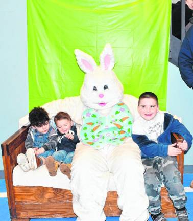 Hudson and Ewan Welch and Easton Thompson pose with the Easter Bunny at Hampton Township Fire &amp; Rescue’s pancake breakfast Sunday, March 10. (Photo by Maria Kovic)