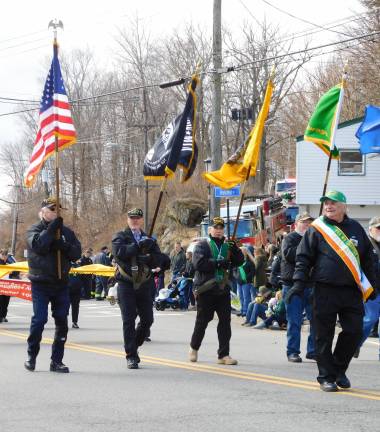 The color guard of the Wallkill Valley Chapter 1002 of the Vietnam Veterans of America lead the way at the entire chapter serves as Grand Marshals of the 2019 Sussex County St. Patrick's Day Parade.
