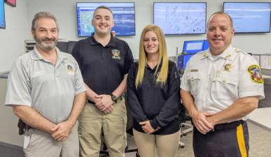 From left: Mark Rozek, director; Brian Cannon and Shannon Quinn, senior public safety telecommunicators; and Michael Strada, Sussex County Sheriff (Photo provided)