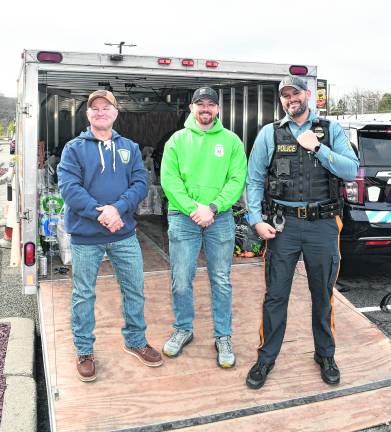 Det. Larry Mendelsohn, Ptl. Scott MacMillan and Sgt. Chris Spaldo stand in front of the truck.